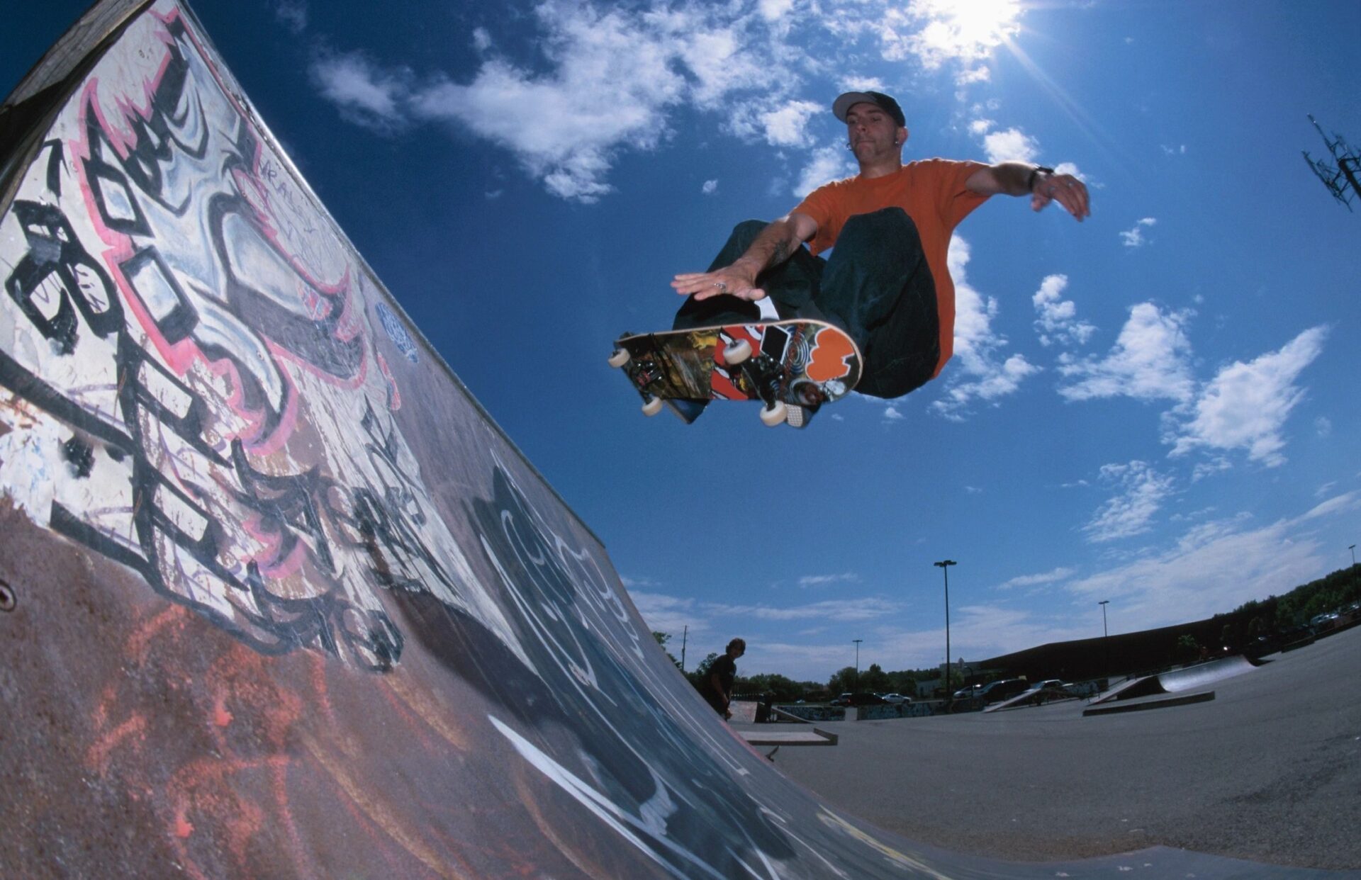 A man flying through the air while riding a skateboard.